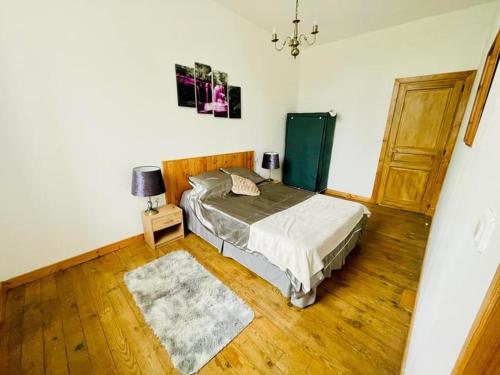 Postel nebo postele na pokoji v ubytování Grand Gite Bidallon