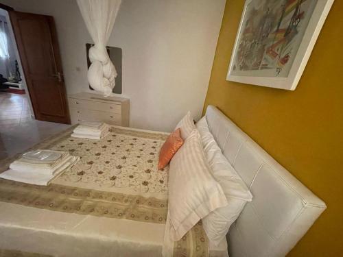 Кровать или кровати в номере Villa Ngorè Saly