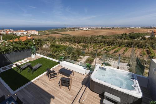 an aerial view of a backyard with a hot tub at Serenidade do Mar in Atouguia da Baleia