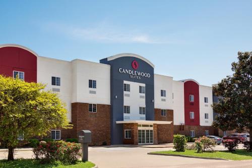 a building with a sign that reads car endowment miles at Candlewood Suites Vicksburg by IHG in Vicksburg