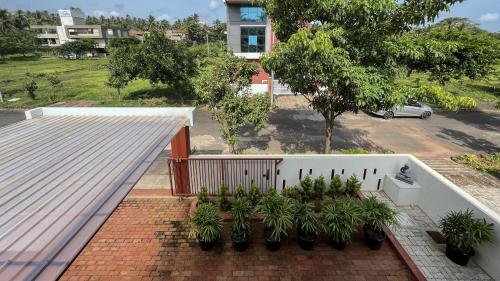 an aerial view of a house with a roof at Pavo Shores by EWA Properties in Suratakal