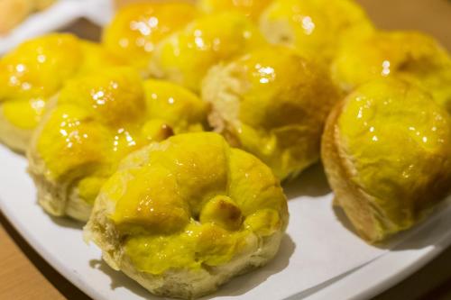 a plate of food with yellow icing on it at Pompeu Rio Hotel in Rio de Janeiro