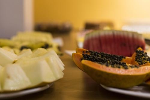 a close up of a cut up fruit on a table at Pompeu Rio Hotel in Rio de Janeiro