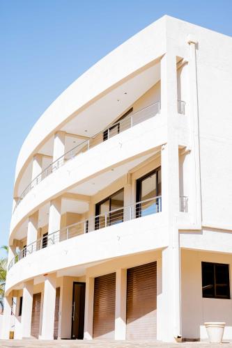 an image of a white building at Guest House Auasblick by State House in Windhoek