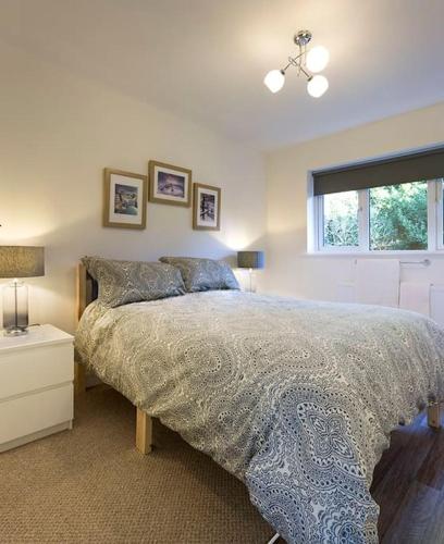 a bedroom with a large bed and a window at 35 Quaker Lane in Darlington