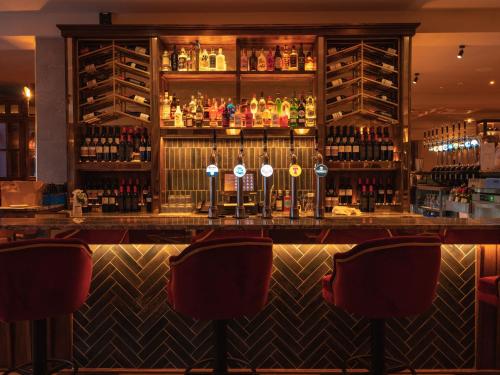 a bar with a lot of bottles of wine at Seagoe Hotel in Portadown