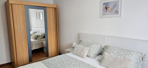 Ένα ή περισσότερα κρεβάτια σε δωμάτιο στο Apartment LAGUNA 08, 08A