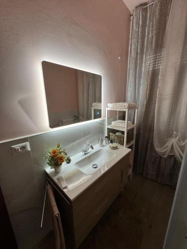 a bathroom with a sink and a mirror at CASA VACANZE DA LUCA in SantʼElpidio a Mare