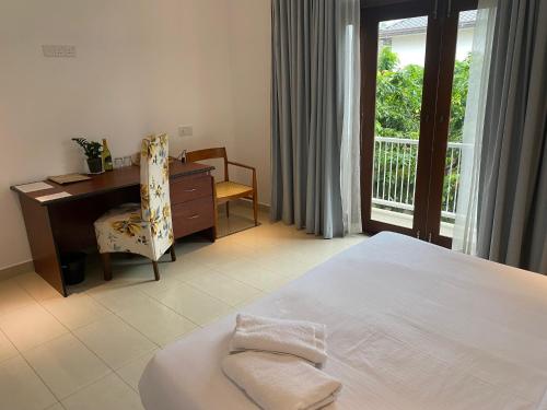 Postel nebo postele na pokoji v ubytování Hotel Cloud 9 Negombo