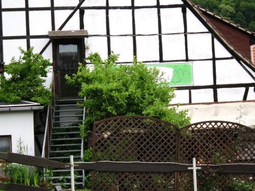 a greenhouse with stairs and a sign on it at Pension Waldblick in Grillenberg