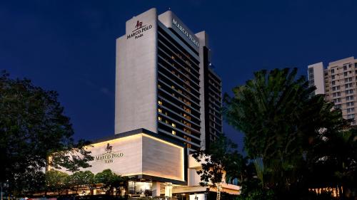 a tall building with a sign on top of it at Marco Polo Plaza Cebu in Cebu City