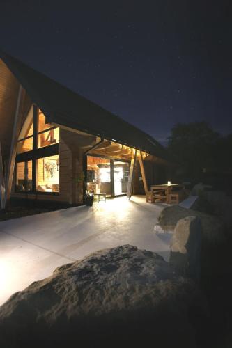 a building with a lit up roof at night at PORTAL WYSOWA in Wysowa-Zdrój