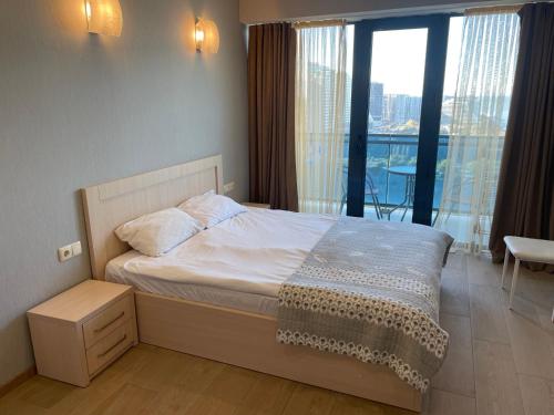Postel nebo postele na pokoji v ubytování Orbi beach tower
