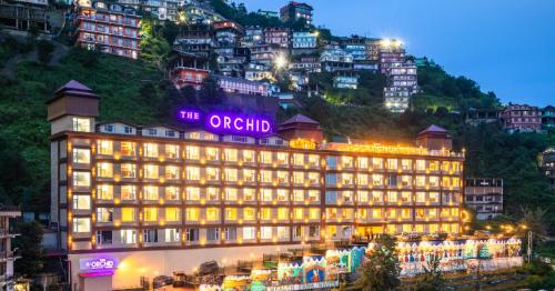 a building with a sign on top of it at The Orchid Shimla in Shimla
