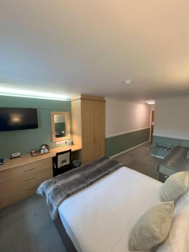Cama o camas de una habitación en Millfields Hotel