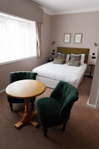 Ένα ή περισσότερα κρεβάτια σε δωμάτιο στο Stanton House Hotel