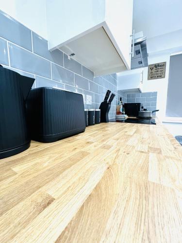 an empty room with a wooden floor in a kitchen at 202 Grosvenor House in Wakefield