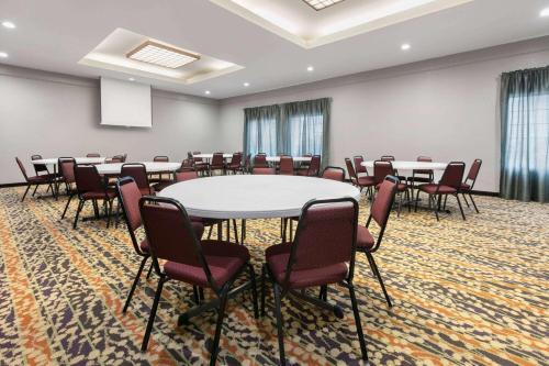 a large room with tables and chairs in it at La Quinta by Wyndham Belton - Temple South in Belton