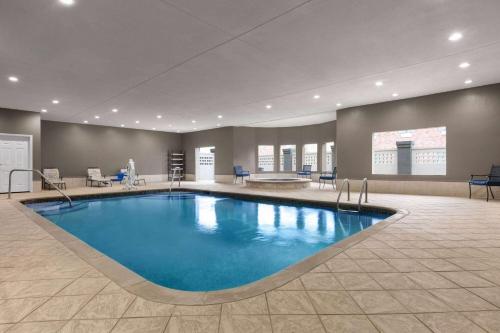 a large swimming pool in a hotel room at La Quinta by Wyndham Belton - Temple South in Belton
