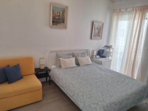 a bedroom with a bed and a couch at Pension Oaza in Hvar