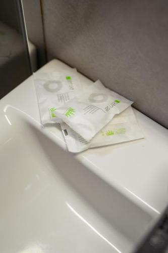 two white towels sitting on top of a table at Apartament Family Rivulus 9 in Baia Mare