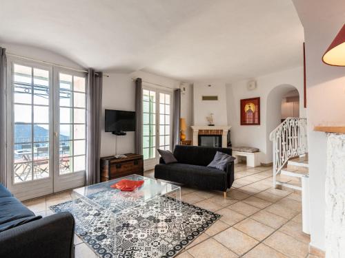 a living room with a couch and a table at Apartment Casa Marcelli by Interhome in SantʼAntonino