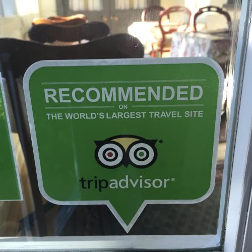 a sign on a glass door with an owl on it at Kurrara Historic Guest House in Katoomba