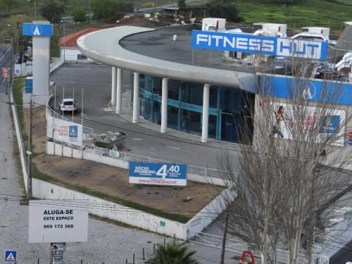 a building with a round top with a parking lot at Be Local - Apartment with 2 bedrooms in Infantado in Loures in Loures
