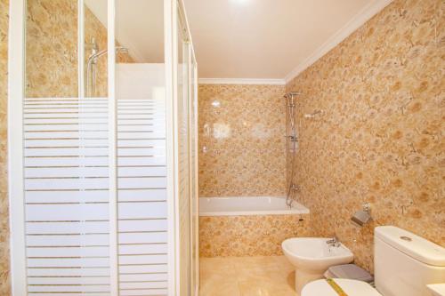 a bathroom with a toilet and a shower at Villa Cohete - Plusholidays in Ifach