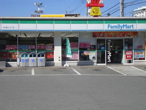 an empty parking lot in front of a store at West Inn Fuji-Yoshida in Fujiyoshida