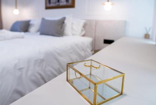 a tray on a table in a bedroom with two beds at Cascade Luxury Apartments in Dubrovnik