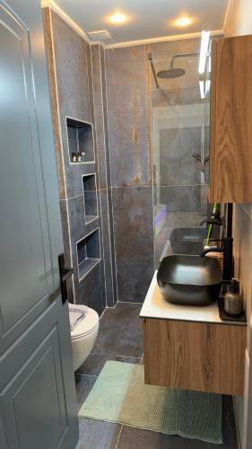 a bathroom with a sink and a shower at George luxury living in Preveza