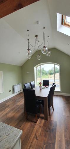a dining room with a table and chairs at The Haggard Self Catering Accommodation in Castleblayney