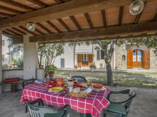 a table with a red and white checkered table cloth at Apartment Le Masse-4 by Interhome in Castelfranco Piandisco