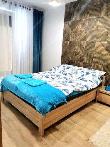 Posteľ alebo postele v izbe v ubytovaní Apartament Kasprowicza