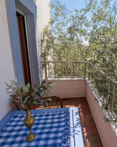 a vase sitting on a table on a balcony at Medin Apartments BluVista in Petrovac na Moru