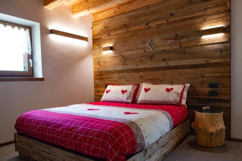 Postel nebo postele na pokoji v ubytování Chalet Grifone - Chalet Maso Vecchio nel cuore del Lagorai Trentino