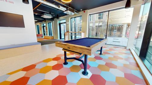 a ping pong table on a floor in a room at Student Only, Ensuite-in a Stylish Apartment at Signal Place in Nottingham