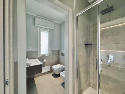a bathroom with a shower and a toilet and a sink at Mameli View Cagliari in Cagliari