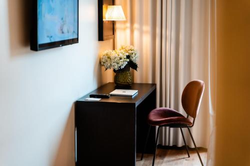 TV a/nebo společenská místnost v ubytování Hotel Capolago