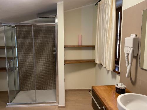 a bathroom with a shower and a sink at Il Borgo Ospitale - Albergo Diffuso in Rotonda