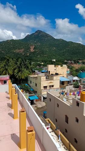 a view of a city from the roof of a building at Sathya Guest House in Tiruvannāmalai