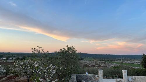 a rainbow in the sky over a city at b&b Olio su Pietra in Castellana Grotte