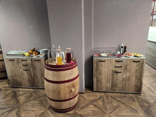 a room with two barrels and a counter with food at Il Borgo Ospitale - Albergo Diffuso in Rotonda