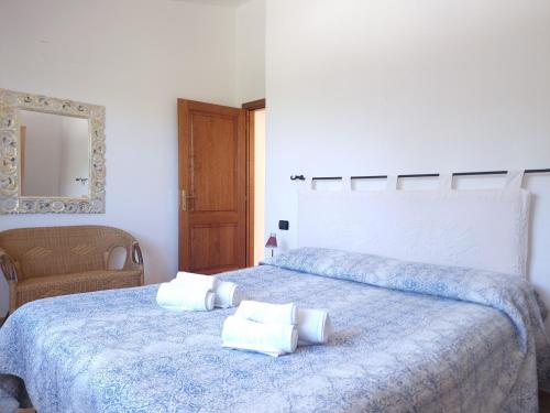 Ένα ή περισσότερα κρεβάτια σε δωμάτιο στο Residenze S'ABBAIDA - BUDONI SWEET HOME