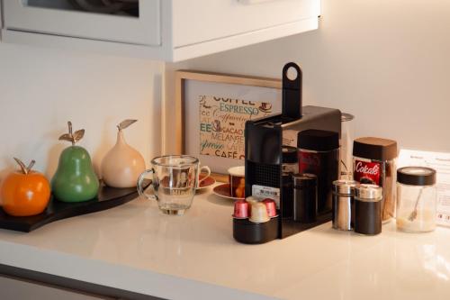 a kitchen counter with a coffee maker and a blender at Luxury El Poblado Loft, relax in Medellin's heart! in Medellín