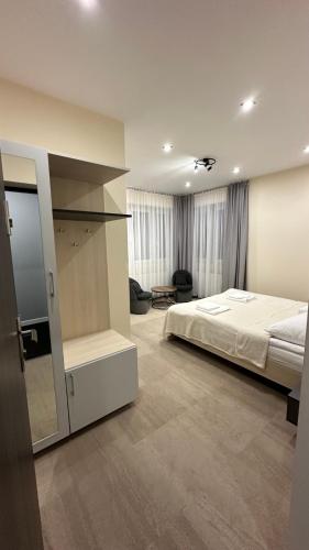 a bedroom with a large bed in a room at Sowica Karpacz in Karpacz