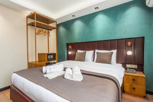 Katil atau katil-katil dalam bilik di Marlon Hotel