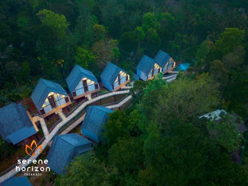 an overhead view of a group of houses in a forest at Serene Horizon in Thekkady