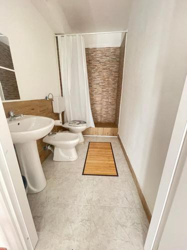 a bathroom with a toilet and a sink at cuore di caserta in Caserta